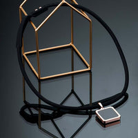 Tera High Power Gauss Magnetic Therapy Necklace in Black Rose Gold, ideal for athletes' energy recovery and performance, by Clavis.