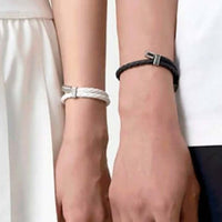 Close-up of two people wearing Neodymium magnetic sports bracelets, showcasing wellness and energy enhancement benefits.