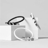 Neodymium 3600 Strap Lightweight Bracelets, boosting energy with magnetic therapy for athletes, in black and white designs.