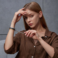 Woman wearing Luna FlexMag High Power Magnetic Therapy Sports Wrap Bracelet in brown.