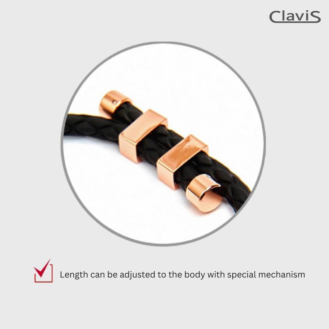 Close-up of Clavis magnetic therapy necklace clasp with adjustable Rose Gold mechanism on black band.