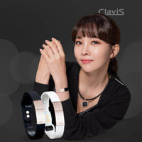 Woman wearing Clavis athletic edition magnetic therapy bracelets for wellness and sports recovery, featuring white and rose gold designs.