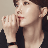 Woman wearing Dona High Power Health Magnetic Bracelet in Black Rose Gold, showcasing Clavis athletic edition style and elegance.