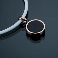 Hero High Power Gauss Magnetic Therapy Necklace from Clavis, designed for athletes, featuring a sleek black and silver pendant.