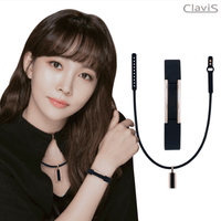 Woman wearing a Clavis athletic edition energy recovery bracelet in white rose gold, endorsing its magnetic therapy benefits.