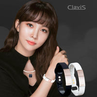 Woman modeling Clavis Tera Magnetic Therapy Bracelet in white and rose gold, highlighting wellness benefits for athletes.