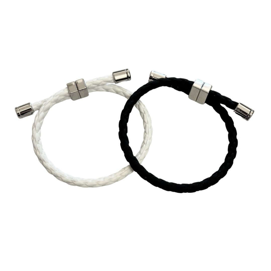 Neodymium 3600 Strap Lightweight Bracelet in black and white, magnetic golf bracelet for energy recovery and athletic performance.