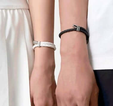 Close-up of two people wearing Neodymium magnetic sports bracelets, showcasing wellness and energy enhancement benefits.