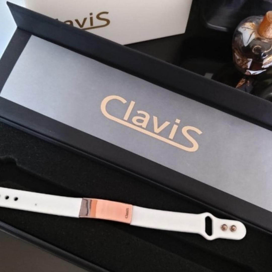 Magnetic golf bracelet for energy, sport performance, and recovery with black band rose gold by Clavis Athletic Edition.