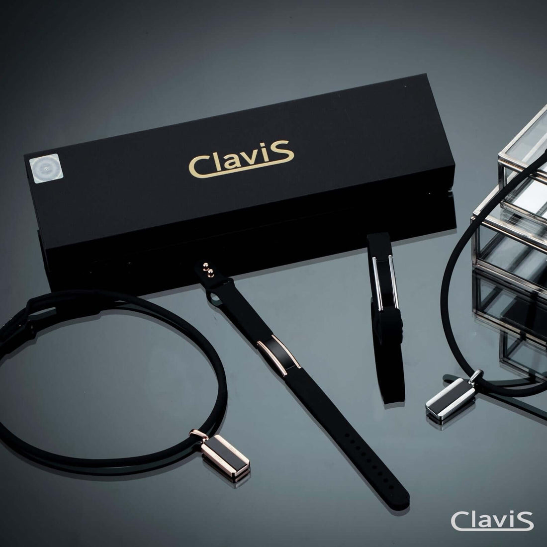 Clavis magnetic bracelet collection featuring adjustable black bands for sport and wellness, with premium packaging for athletic performance.