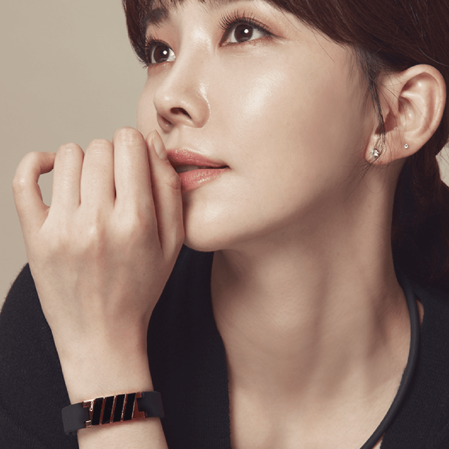 Dona High Power Health Magnetic Bracelet in White Rose Gold, worn by a model. Designed for pain relief and performance boost.