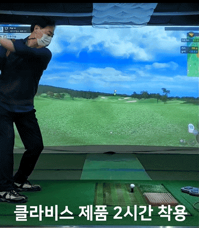 Golfer wearing Clavis magnetic bracelet at indoor golf simulator for performance enhancement