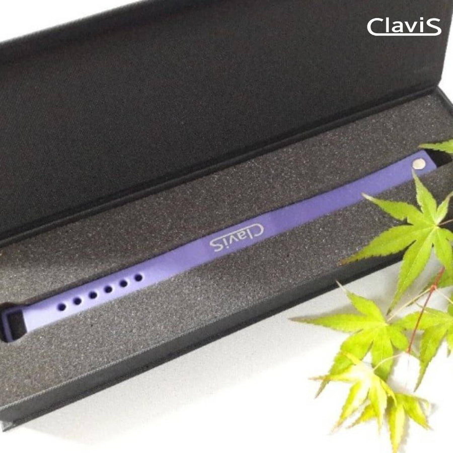 Purple Clavis athletic edition magnetic golf bracelet in gift box; enhances sport performance, energy recovery, and golf wellness.