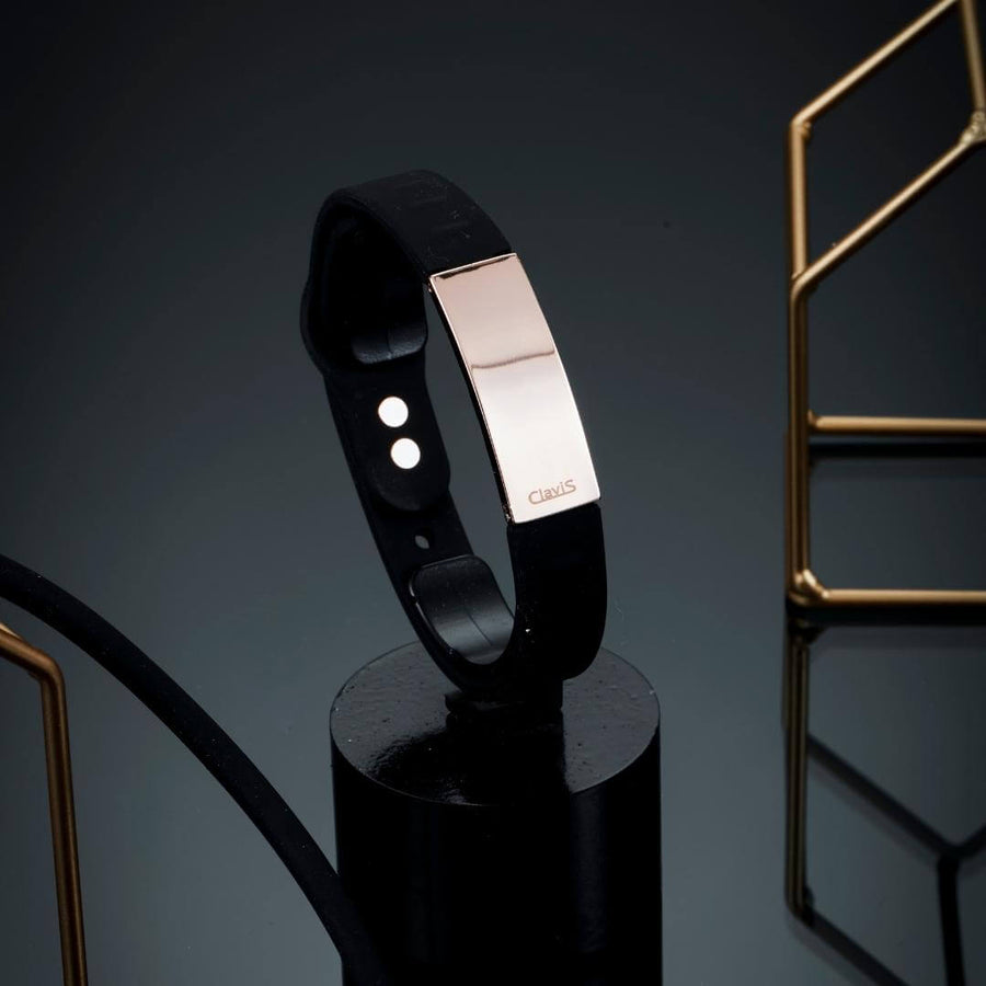 Black and rose gold magnetic golf bracelet for sports and energy recovery. Clavis athletic edition, Korean wellness, magnetic therapy.