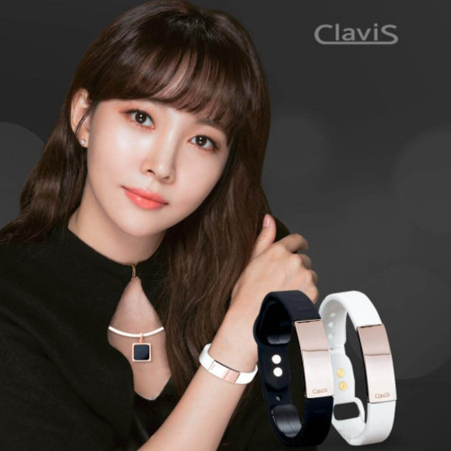 Woman wearing Clavis magnetic golf bracelet with black and white options, enhances sport performance and wellness.