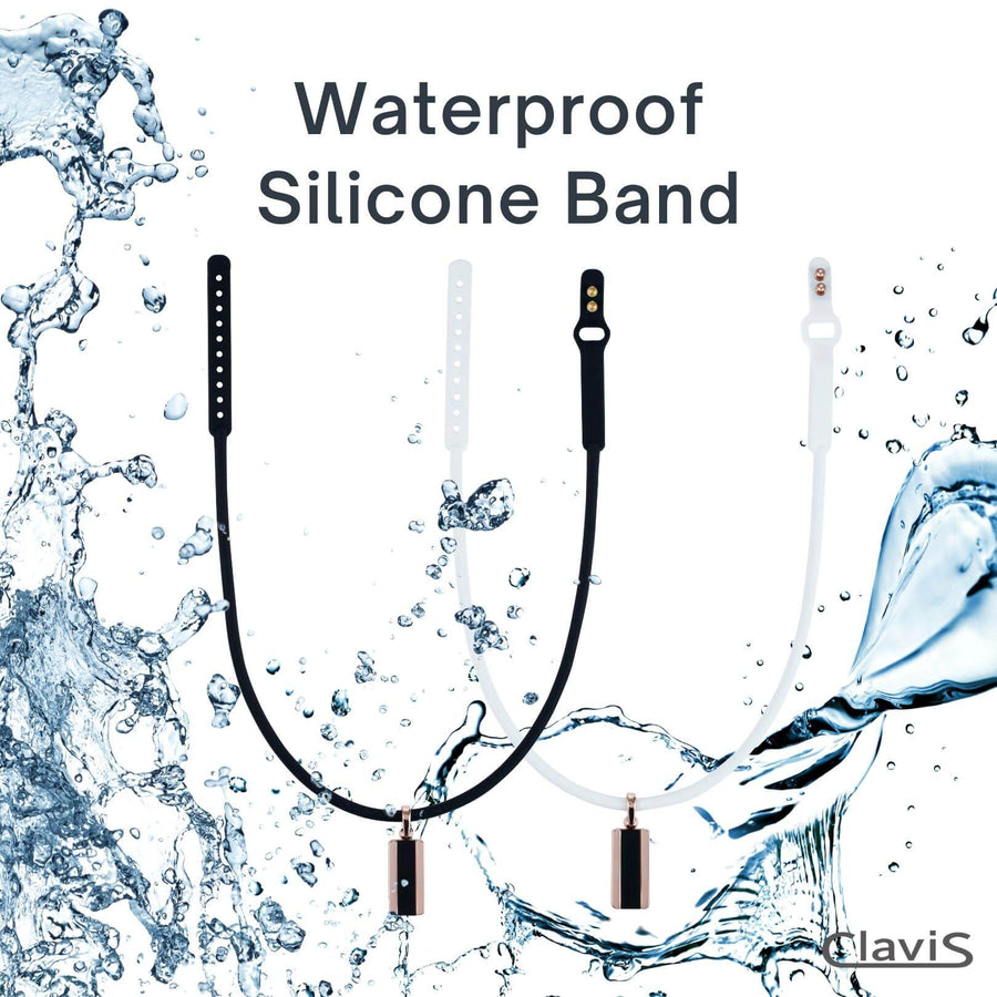 Waterproof Clavis silicone band in black and white with splash effect, ideal for sports and recovery.